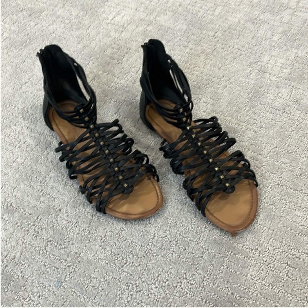 9.5 black strappy gladiator sandals with metal details and back zipper